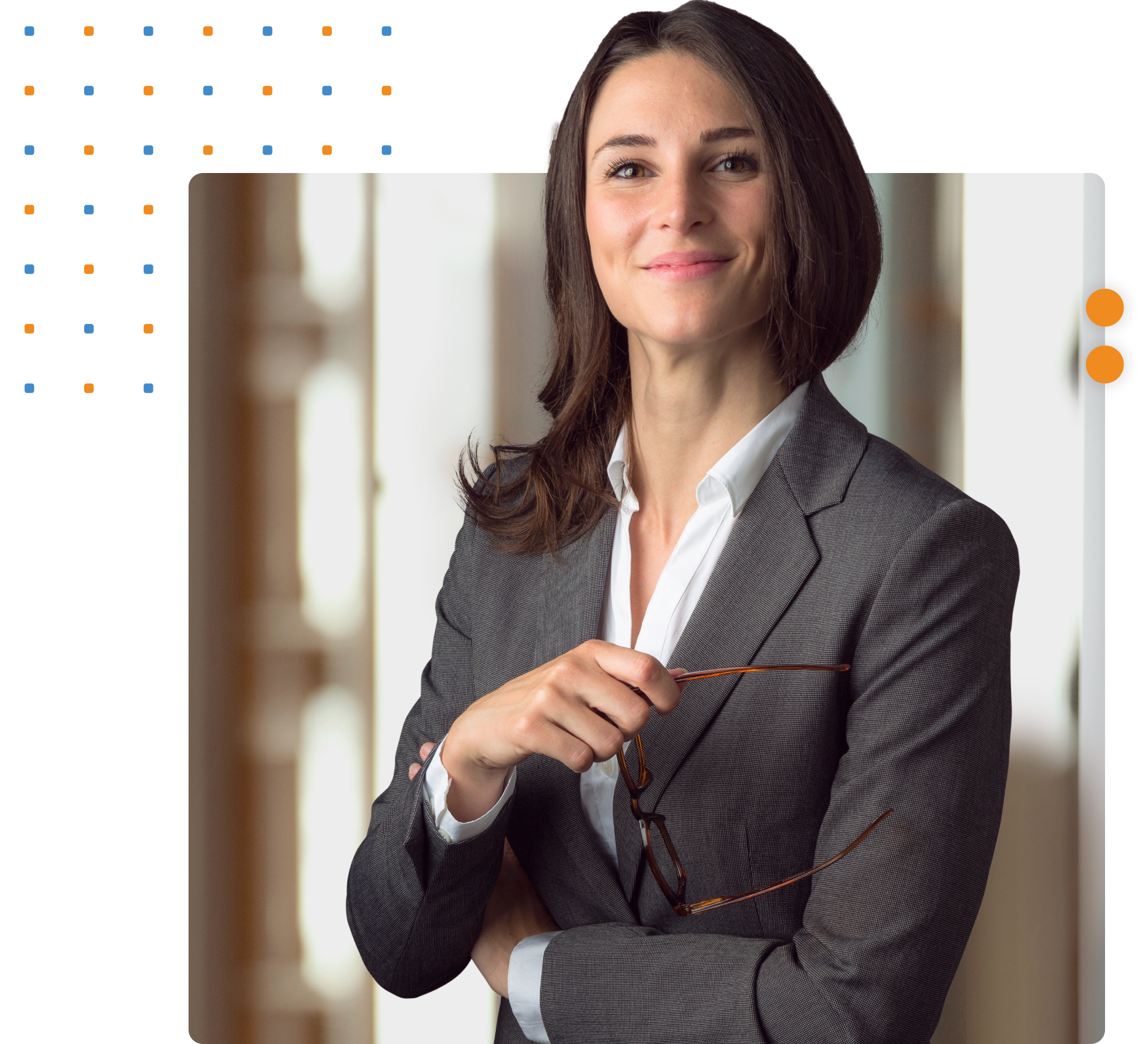 Woman in professional suit smiling at camera looking confident