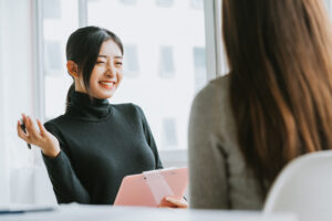 Happy interviewer asking culture fit interview questions